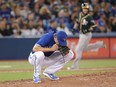 Tyler Clippard of the Blue Jays is downcast after giving up a grand slam home run to Chad Pinder of the Oakland Athletics in the eighth inning of their game at Rogers Centre in Toronto on Saturday.