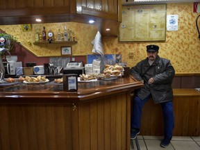 A man rests inside in a typical bar of the Basque Country, in San Sebastian, northern Spain, Wednesday, May 2, 2018. The disbanding of Basque militant group ETA announced for this week has laid bare the scars of one of Europe's last violent conflicts.