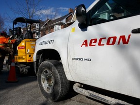 Aecon Group Inc. signage is displayed on a truck parked at a construction site in Toronto, Ontario, Canada, on Monday, Feb. 26, 2018. Prime Minister Justin Trudeau's government has launched a full national security review of a takeover bid by China Communications Construction Co. for Aecon Group Inc., a Canadian construction company.