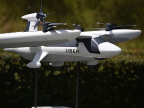 A model of Uber's electric vertical take-off  and  landing vehicle concept (eVTOL) flying taxi is displayed at the second annual Uber Elevate Summit, on May 8, 2018 at the Skirball Center in Los Angeles, California.