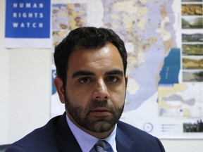 Human Rights Watch's Israel and Palestine director Omar Shakir, a US citizen, sits at his office in the West Bank city of Ramallah on May 9, 2018.