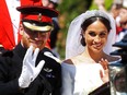 Meghan, Duchess of Sussex begins her carriage procession with Britain's Prince Harry, Duke of Sussex in the Ascot Landau Carriage after their wedding ceremony at St George's Chapel, Windsor Castle, in Windsor, on May 19, 2018.