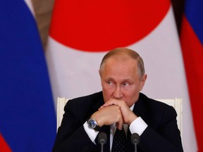 Russian President Vladimir Putin attends a joint news conference with Japanese Prime Minister Shinzo Abe following their meeting at the Kremlin in Moscow on May 26, 2018.