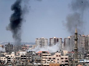 A picture taken from Gaza City on May 29, 2018, shows smoke billowing in the background following an Israeli air strike on the Palestinian enclave.