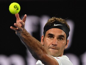 Roger Federer serves to Hyeon Chung at the Australian Open on Jan. 26.