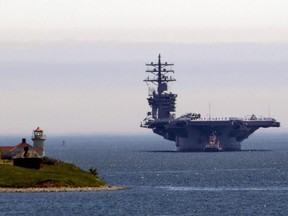 The aircraft carrier USS Dwight D. Eisenhower arrives in Halifax, Wednesday, June 28, 2017.