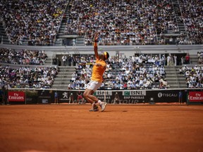 Spain's Rafael Nadal serves the ball to Italy's Fabio Fognini during a quarter final match at the Italian Open tennis tournament in Rome, Friday, May 18, 2018. Nadal won 4-6, 6-1, 6-2.