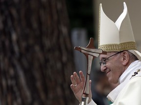 Pope Francis delivers his blessing during his visit at the Santissimo Sacramento parish church, in the outskirts of Rome, Sunday, May 6, 2018.