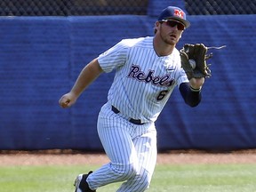 Mississippi's Thomas Dillard (6) catches a fly ball for an out on Georgia's Aaron Schunk (22) during the first inning of a Southeastern Conference Tournament NCAA college baseball game, Thursday, May 24, 2018, in Hoover, Ala.