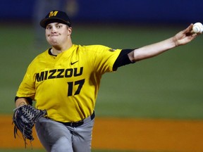 Missouri's T.J. Sikkema (17) throws a pitch during the first inning of a Southeastern Conference tournament NCAA college baseball game against South Carolina, Tuesday, May 22, 2018, in Hoover, Ala.