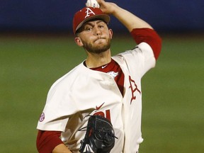 Arkansas pitcher Kacey Murphy (21) throws during the first inning of a Southeastern Conference tournament NCAA college baseball game abasing South Carolina, Wednesday, May 23, 2018, in Hoover, Ala.