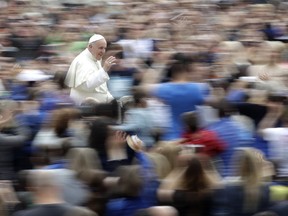 Pope Francis arrives in St. Peter's Square at the Vatican, for his weekly general audience, Wednesday, May 23, 2018.