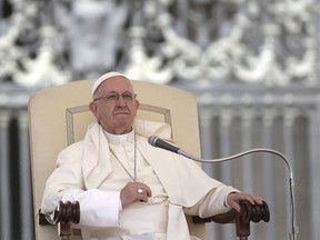 Pope Francis sits during his weekly general audience in St. Peter's Square at the Vatican, Wednesday, May 16, 2018. Pope Francis warned Wednesday that the latest spasm of violence in the Holy Land is only hurting chances for peace, and called for revived efforts at dialogue and justice.