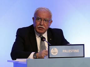 Palestinian Foreign Minister Riyad al-Maliki makes a speech as he attends the Extraordinary summit of the Organization of Islamic Cooperation (OIC) in Istanbul, Turkey, Friday, May 18, 2018. Turkey has called on Muslim nations to stand with Palestinians and to work to stop countries joining the United States in relocating their Israeli embassy from Tel Aviv to Jerusalem.(Anadolu Agency/Pool via AP)