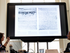 A video shows the text underneath two taped off pages from Anne Frank’s diary during a press conference at The Anne Frank Foundation’s office in Amsterdam, Netherlands, May 15, 2018.
