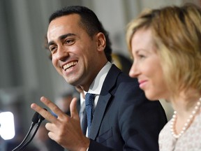 Five Stars Movement leader Luigi Di Maio, left, flanked by his colleague Giulia Grillo,  talks to media at the Quirinale presidential palace after talks with Italian President Sergio Mattarella, in Rome, Monday, May 7, 2018. Mattarella held today another day of consultations aimed at identifying whether any party or coalition can muster support to form a government after the March 4 election produced no majority in parliament.