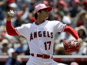 Los Angeles Angels starting pitcher Shohei Ohtani, of Japan, throws against the Minnesota Twins during the first inning of a baseball game in Anaheim, Calif., Sunday, May 13, 2018.