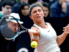 Sara Errani of Italy returns the ball to Timea Babos of Hungary during their match at the Italian Open tennis tournament, Tuesday  May 15, 2018.