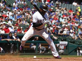 Texas Rangers' Delino DeShields reacts after getting hit on the foot by a pitch thrown by Boston Red Sox starting pitcher Chris Sale during the fifth inning of a baseball game, Sunday, May 6, 2018, in Arlington, Texas.