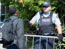An asylum seeker is questioned by an RCMP officer as he crosses the border into Canada from the United States. Canada doesn't have the resources to patrol its 8,000 kilometre border.