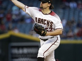 Arizona Diamondbacks starting pitcher Zack Godley throws to a Los Angeles Dodgers batter during the first inning of a baseball game Wednesday, May 2, 2018, in Phoenix.