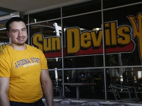 Arizona State University student David Montenegro stands out in front of the Memorial Union building at ASU Thursday, May 10, 2018, in Tempe, Ariz. Montenegro and more than 2,300 public college students around Arizona with deferred deportation status must now pay thousands more in tuition annually starting this fall under a state Supreme Court decision eliminating their lower in-state tuition.