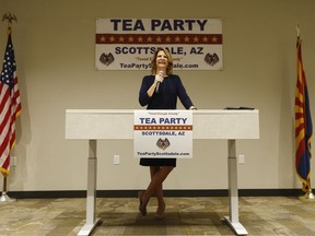 In this May 17, 2018, photo, Republican Senate candidate Kelli Ward talks about her platform policies at a Scottsdale Tea Party event in Scottsdale, Ariz. Arizona conservatives are torn between two icons of their movement - former Sheriff Joe Arpaio and former state senator Ward - in the GOP Senate primary.