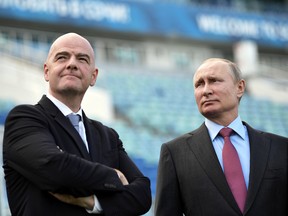 FIFA president Gianni Infantino, left, visits the World Cup venue in Slovyansk, Russia, on Thursday, May 3, 2018 with Russian President Vladimir Putin.