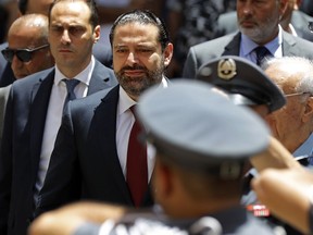 Outgoing Lebanese Prime Minister Saad Hariri, center, arrives to parliament to attend a session for the election of the house speaker, in Beirut, Lebanon, Wednesday, May 23, 2018. Lebanese lawmakers have overwhelmingly re-elected the longtime octogenarian parliament speaker, Nabih Berri, to the post, giving him monopoly of the office for 30 years.