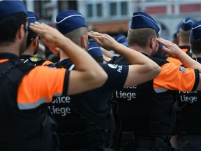 Liege police take part in a tribute ceremony for the vicitms of a shooting in Liege on May 30, 2018.  An attack that killed two policewomen and a male bystander in the eastern Belgian city of Liege on May 29, 2018 amount to "terrorist murder," prosecutors spokesman said during a press conference.