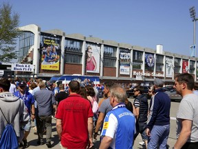 In this Sunday, May 13, 2018 photo, supporters of Germany's second league soccer team Holstein Kiel enter the stadium, prior to the match against Eintracht Braunschweig. Holstein Kiel faces a two-leg playoff against VfL Wolfsburg, for playing in the first league Bundesliga on Thursday, May 17, 2018.