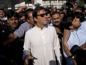 Pakistan's opposition politician Imran Khan leaves Parliament after a session in Islamabad, Pakistan, Thursday, May 24, 2018. Pakistan's lower house of parliament, with rare support from the opposition, has passed a bill to give equal rights to 5 million people living in the country's tribal areas.