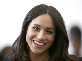 In this Wednesday April 18, 2018 file photo, Meghan Markle attends a reception with Britain's Prince Harry for the Commonwealth Youth Forum at the Queen Elizabeth II Conference Centre, London, during the Commonwealth Heads of Government Meeting. Royal officials said Friday May 4, 2018, Meghan Markle's divorced parents Thomas Markle and Doria Ragland will come to London before her May 19 wedding to Prince Harry and will meet with Queen Elizabeth II and other royals.