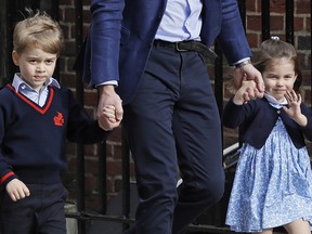 In this  Monday, April 23, 2018 file photo, Britain's Prince William arrives with Prince George and Princess Charlotte at the Lindo wing at St Mary's Hospital in London.