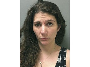 This booking photograph released Tuesday, May 8, 2018, by the Vermont State Police shows Erika Guttilla, arrested charged with killing Troy Ford, her live-in boyfriend, with help from her mother last fall and keeping the corpse in a trash bin on the porch for months before dumping the body in the woods in Highgate, Vt. (Vermont State Police via AP)