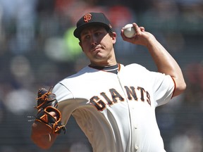 San Francisco Giants pitcher Derek Holland works against the San Diego Padres in the first inning of a baseball game Wednesday, May 2, 2018, in San Francisco.