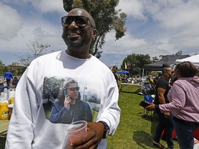 Aloysius McMahan from Oakland made a shirt representing the reason why he and many others in the Black community were at Lake Merritt in Oakland, Calif., barbecuing at the "BBQ-ing while Black" event at the lake off Lakeshore Avenue on Sunday, May 20, 2018. Hundreds in the African American community came out to Lake Merritt in response to a confrontation caught on video a few weeks ago when someone complained to police about a group of black people barbecuing.