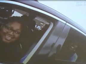 This April 30, 2018 image taken from video of body camera footage released by the Rialto Police Department and provided by KABC-TV, shows two women in a car pulled over by police in Rialto, Calif. New video released by police Tuesday, May 8, 2018, shows officers joking with three black people considering suing over what they say was an excessive response to a racially motivated 911 call in Southern California. The body camera footage released by the Rialto Police Department shows a laid-back and at times light-hearted interaction between officers and the group they had pulled over, which included the granddaughter of reggae legend Bob Marley.  (KABC-TV via AP)