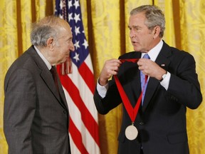 FILE - In this Nov. 15, 2007 file photo, President Bush, right, presents the 2007 National Humanities Medal to author and historian Richard Pipes of Cambridge, Mass., during a ceremony in the East Room of the White House in Washington. Pipes, a renowned scholar of Russian history and aide to President Ronald Reagan has died in Massachusetts at age 94. His son, Daniel Pipes, says his father died early Thursday morning, May 17, 2018, at a nursing home near his residence in Cambridge.