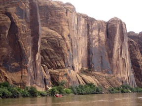 FILE - In this July 25, 2017, file photo, rafters float down the Colorado River near Moab, Utah. Rivers are drying up, popular mountain recreation spots are closing and water restrictions are in full swing as a persistent drought intensifies its grip on pockets of the American Southwest. Climatologists and other experts are scheduled Wednesday, May 23, 2018, to provide an update on the situation in the Four Corners region - where Arizona, New Mexico, Colorado and Utah meet.