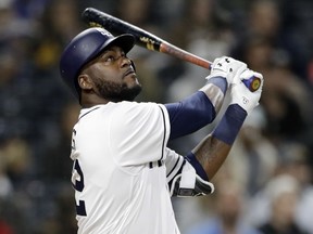 San Diego Padres' Franmil Reyes watches his home run during the fourth inning of the team's baseball game against the Miami Marlins on Wednesday, May 30, 2018, in San Diego.