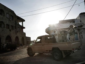 In this Feb. 12, 2018 photo, Saudi-led coalition backed forces patrol Mocha, Yemen. The modern Middle East has been plagued by ruinous wars: country versus country, civil wars with internecine and sectarian bloodletting, and numerous eruptions centered in the Israeli-Palestinian conflict. But never in the last 70 years have they seemed as interconnected as now with Iran and Saudi Arabia vying for regional control, while Israel also seeks to maintain a military supremacy of its own.