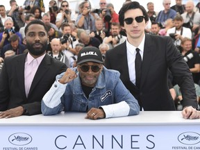 Actor John David Washington, from left, director Spike Lee, and Adam Driver pose for photographers during a photo call for the film 'BlacKkKlansman' at the 71st international film festival, Cannes, southern France, Tuesday, May 15, 2018.