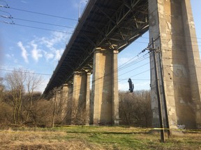 A blue Honda Civic with its interior stripped out was found dangling from a cable high above the Don Valley River beneath bridge that connects Leaside to East York on May 2, 2018. After determining the car was not part of a movie shoot, the vehicle was cut down and Toronto Police are now investigating the mysterious incident.