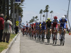 The peloton rides along Ocean Boulevard during the first stage of the Amgen Tour of California cycling race, Sunday, May 13, 2018, in Long Beach, Calif.