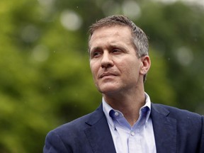 FILE - In this May 17, 2018 file photo, Missouri Gov. Eric Greitens looks on before speaking at an event near the capitol in Jefferson City, Mo. Allegations of sexual misconduct and campaign finance violations against Greitens have been shared with federal authorities by both a private attorney and a key lawmaker, according to testimony Thursday, May 24, 2018, during a legislative hearing by a special committee considering whether to recommend impeachment.