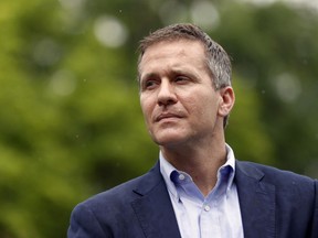 FILE - In this May 17, 2018 file photo, Missouri Gov. Eric Greitens looks on before speaking at an event near the capitol in Jefferson City, Mo. Greitens, a sometimes brash outsider whose unconventional resume as a Rhodes Scholar and Navy SEAL officer made him a rising star in Republican politics, abruptly announced his resignation Tuesday, May 29, 2018, after a scandal involving an affair with his former hairdresser led to a broader investigation by prosecutors and state legislators.