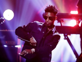 FILE - In this Sept. 17, 2016 file photo, 21 Savage performs during the BET Hip Hop Awards in Atlanta. Police around the country have responded to hundreds of neighborhood paintball fights since the beginning of April - a trend authorities say started around the time an Atlanta rapper 21 Savage began posting YouTube videos with the message, "Guns Down, Paintballs Up."