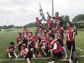 In this 2017 photo provided by Franky Jackson, members of the Lightning Stick Society lacrosse team pose with their 2017 Dakota Premier Lacrosse League championship trophy. The team is one of three that was kicked out of the youth league this year amid concerns about racial abuse.
