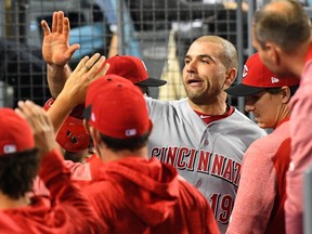 Cincinnati Reds first baseman Joey Votto celebrates a run he scored against the Los Angeles Dodgers on May 10.